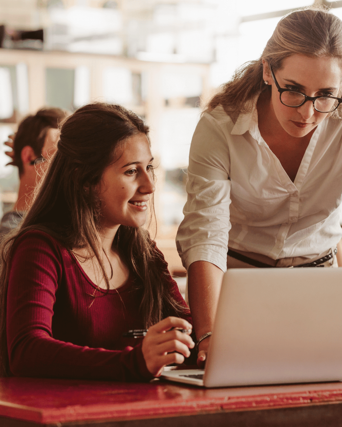 Student meeting with teacher to discuss college recommendation letter