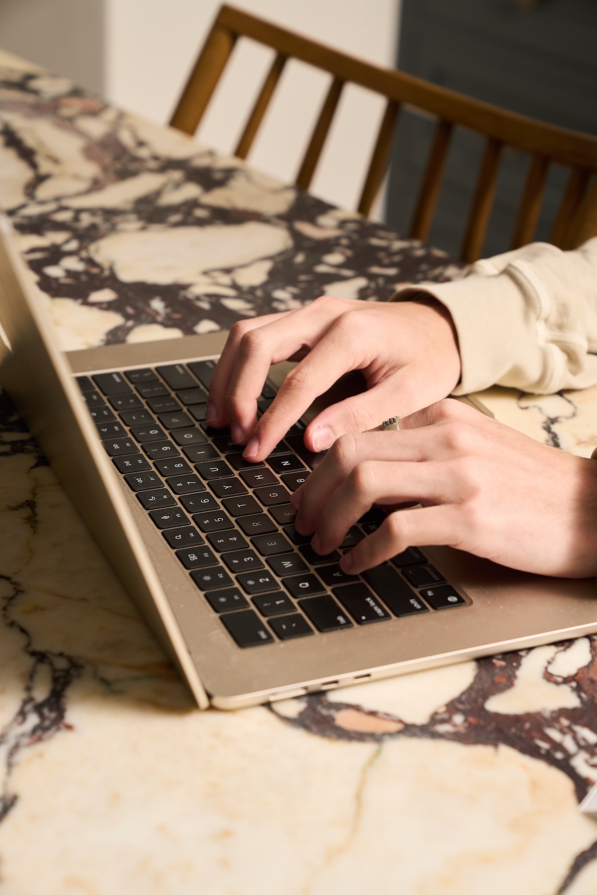 High school student working on resume for college applications